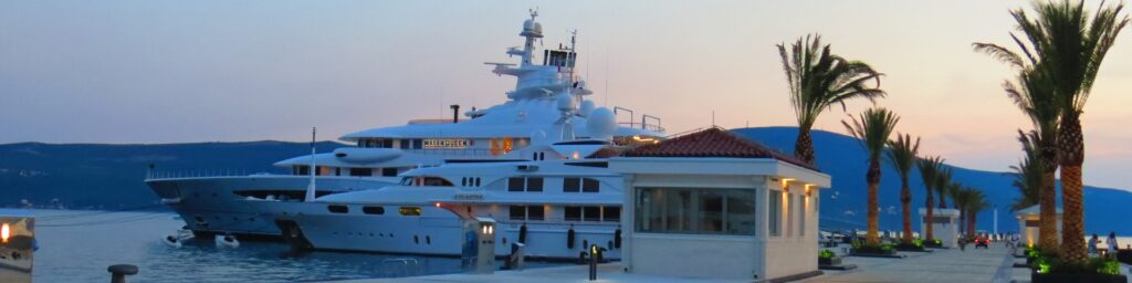 Luxury Yachts Moored On Tropical Harbor